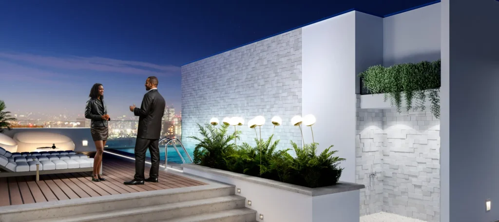 man and woman on a roof top terrace of a luxury apartment in Ghana