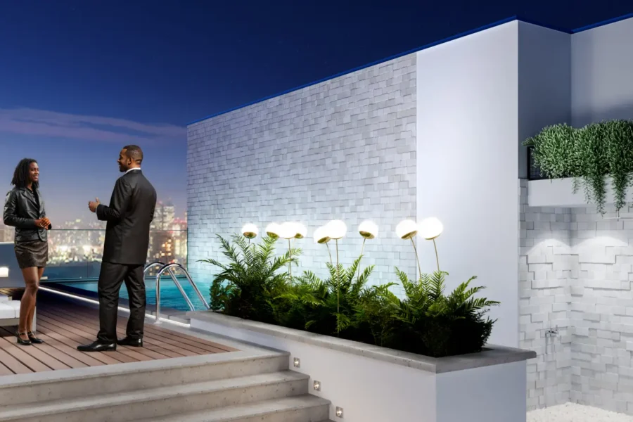 man and woman on a roof top terrace of a luxury apartment in Ghana